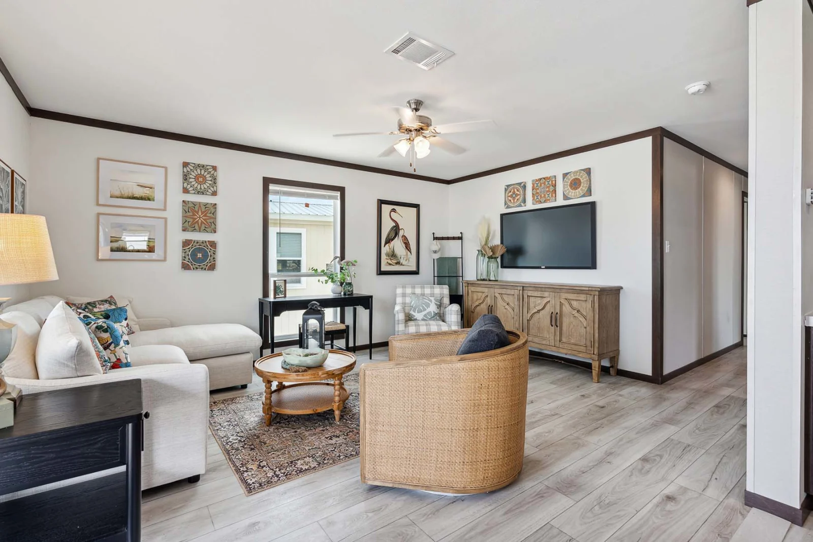 Interior view of a Cedar Ridge park model tiny home living room with vaulted ceiling